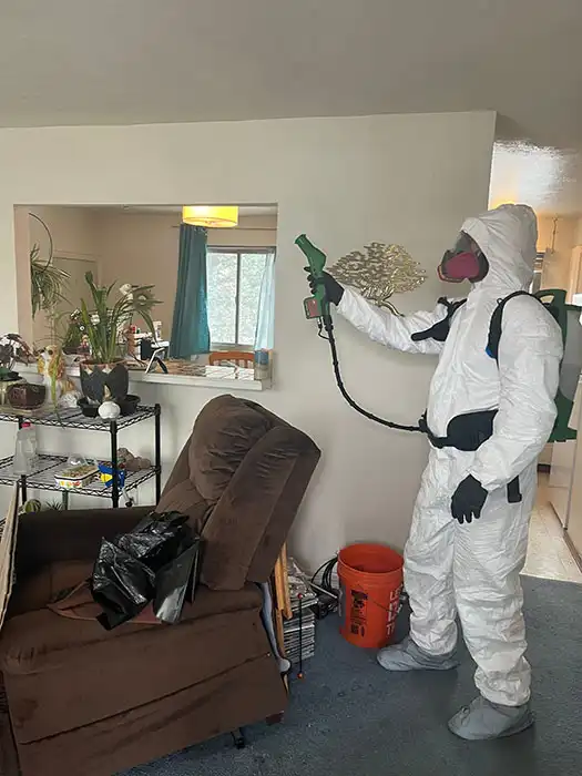 biohazard technician decontaminating a home