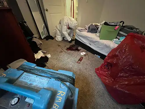 biohazard technician cleaning blood after a death